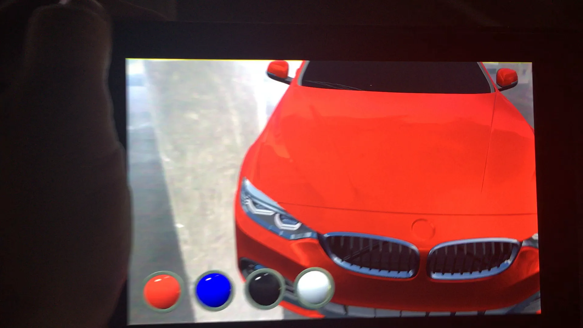Front view of an orange virtual car with realistic reflections